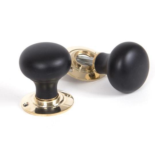 Ebony & Polished Brass Bun Mortice/Rim Knob Setin our Door Knobs collection by From The Anvil. Available to buy at Yorkshire Architectural Hardware